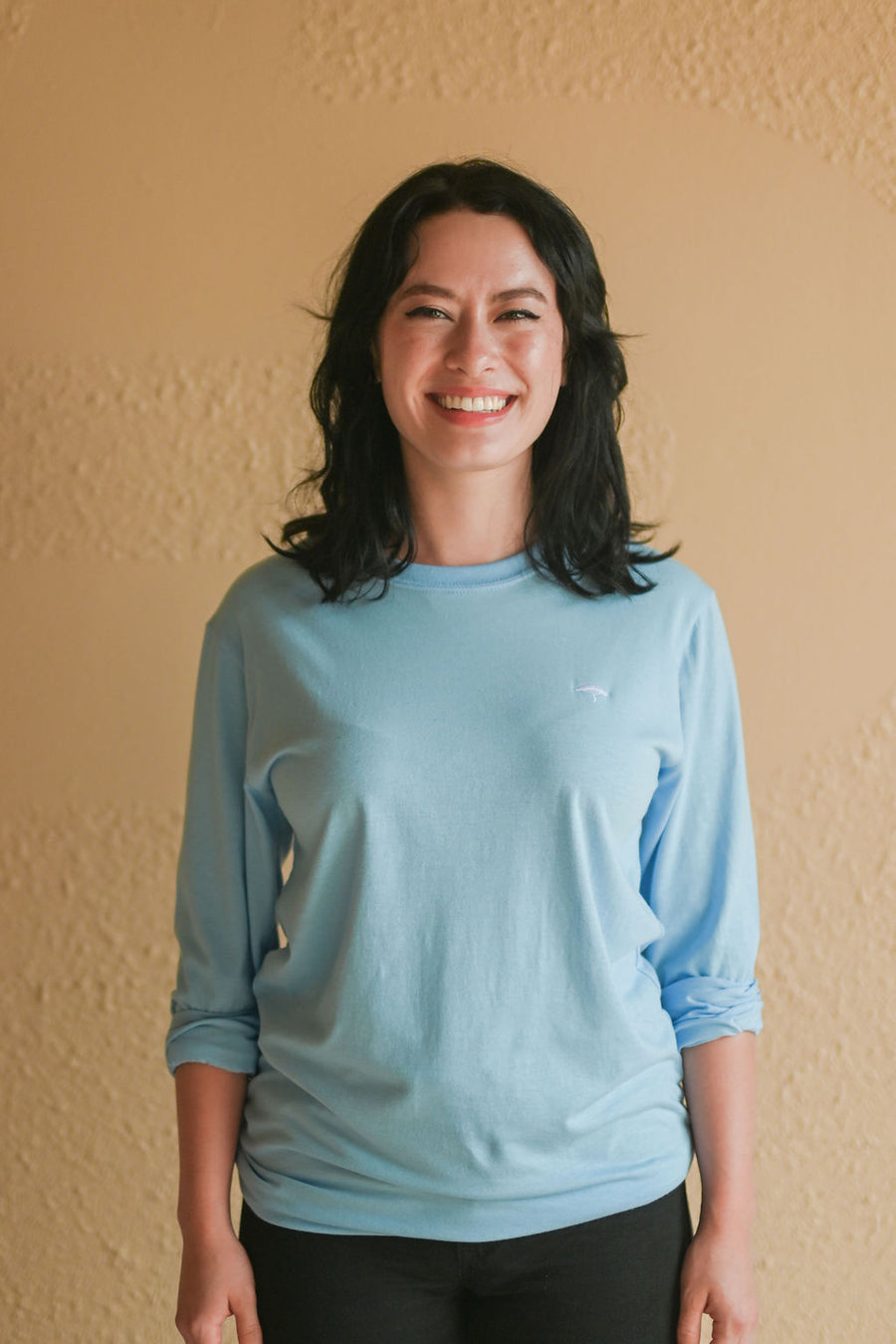 Light blue recycled unisex long sleeve shirt with small white Ungalli tree on front