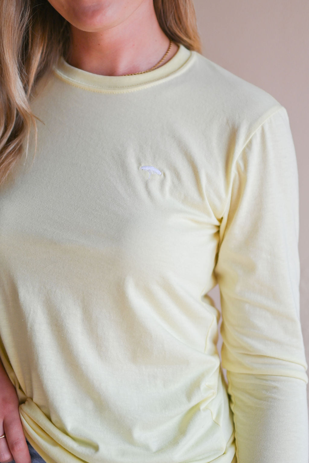 Unisex ethically made long sleeve yellow shirt with small white ungalli tree on front