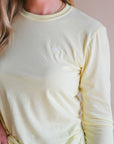 Unisex ethically made long sleeve yellow shirt with small white ungalli tree on front