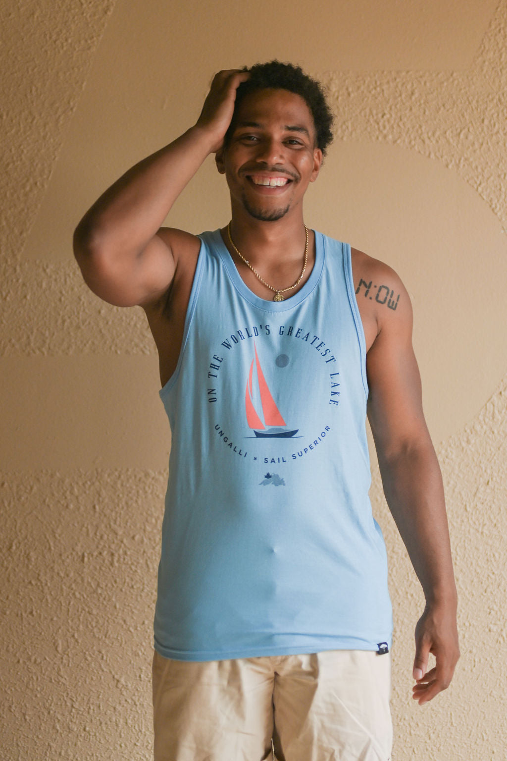 Men's organic light blue tank top with sail boat 'greatest lake' design on front