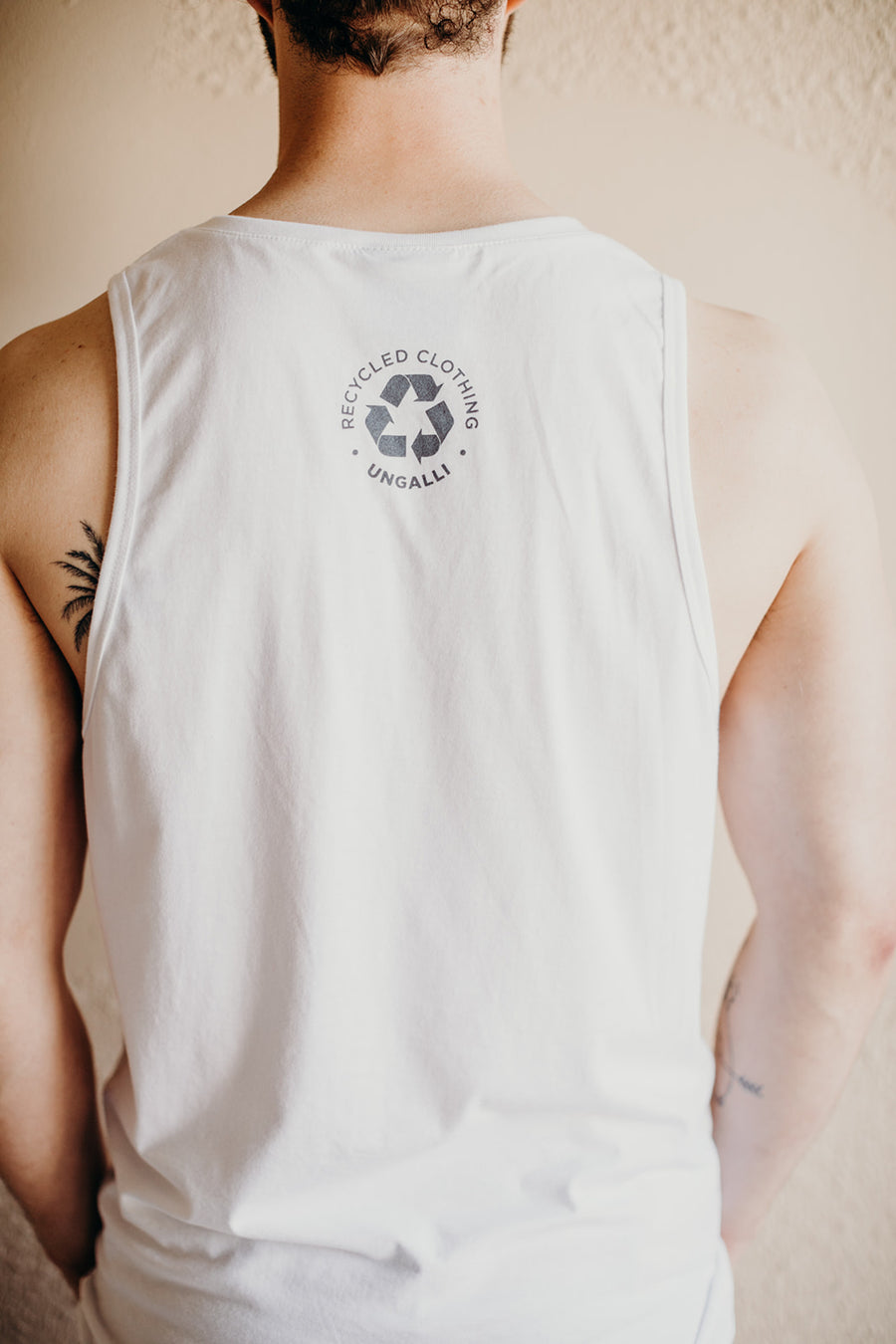 Men's recycled white tank top with small grey Ungalli logo on front