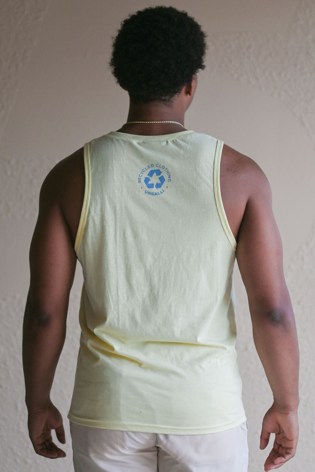 Men's recycled yellow tank top with light blue Ungalli logo across front