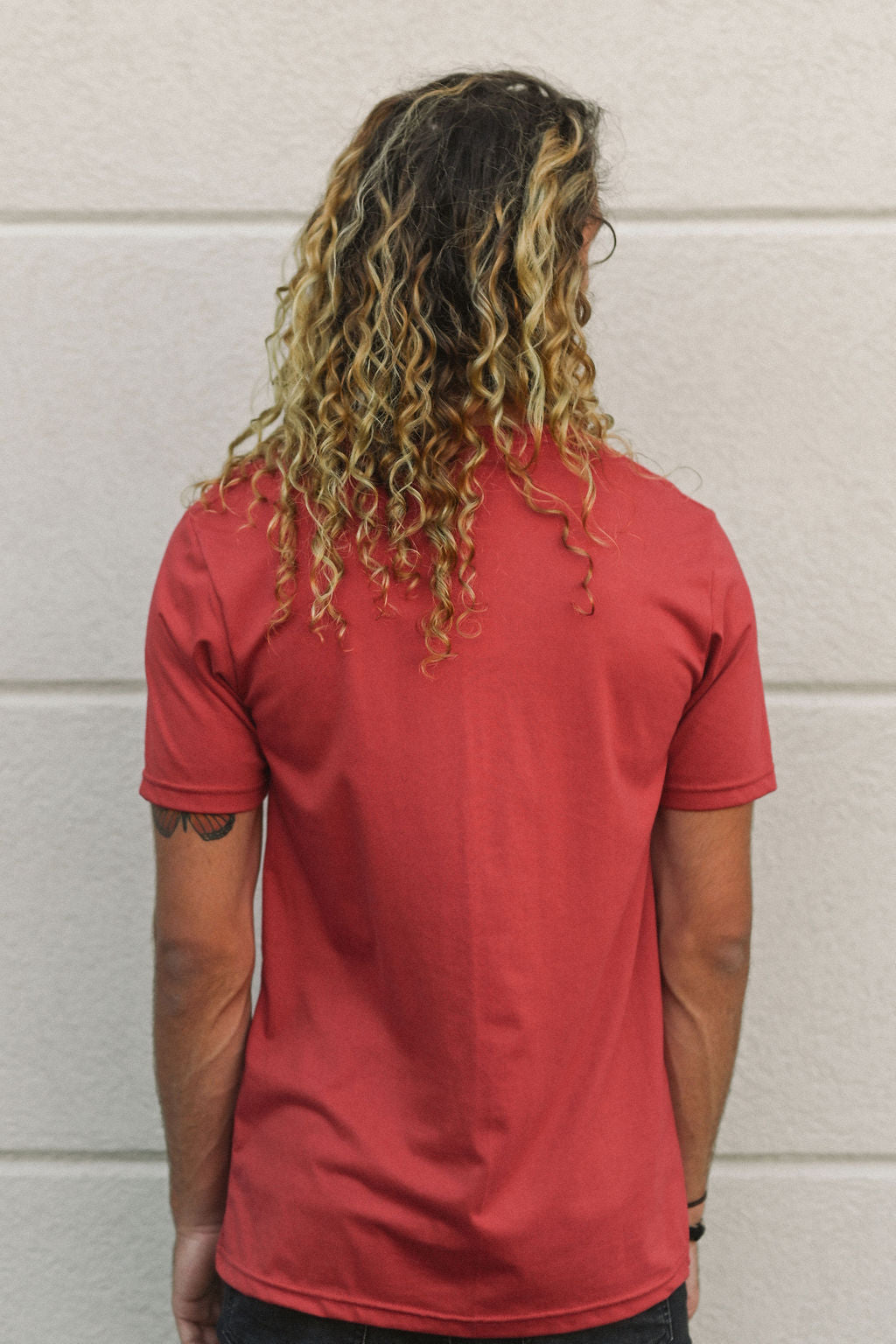 Unisex sustainably made red t-shirt with small white ungalli tree on front