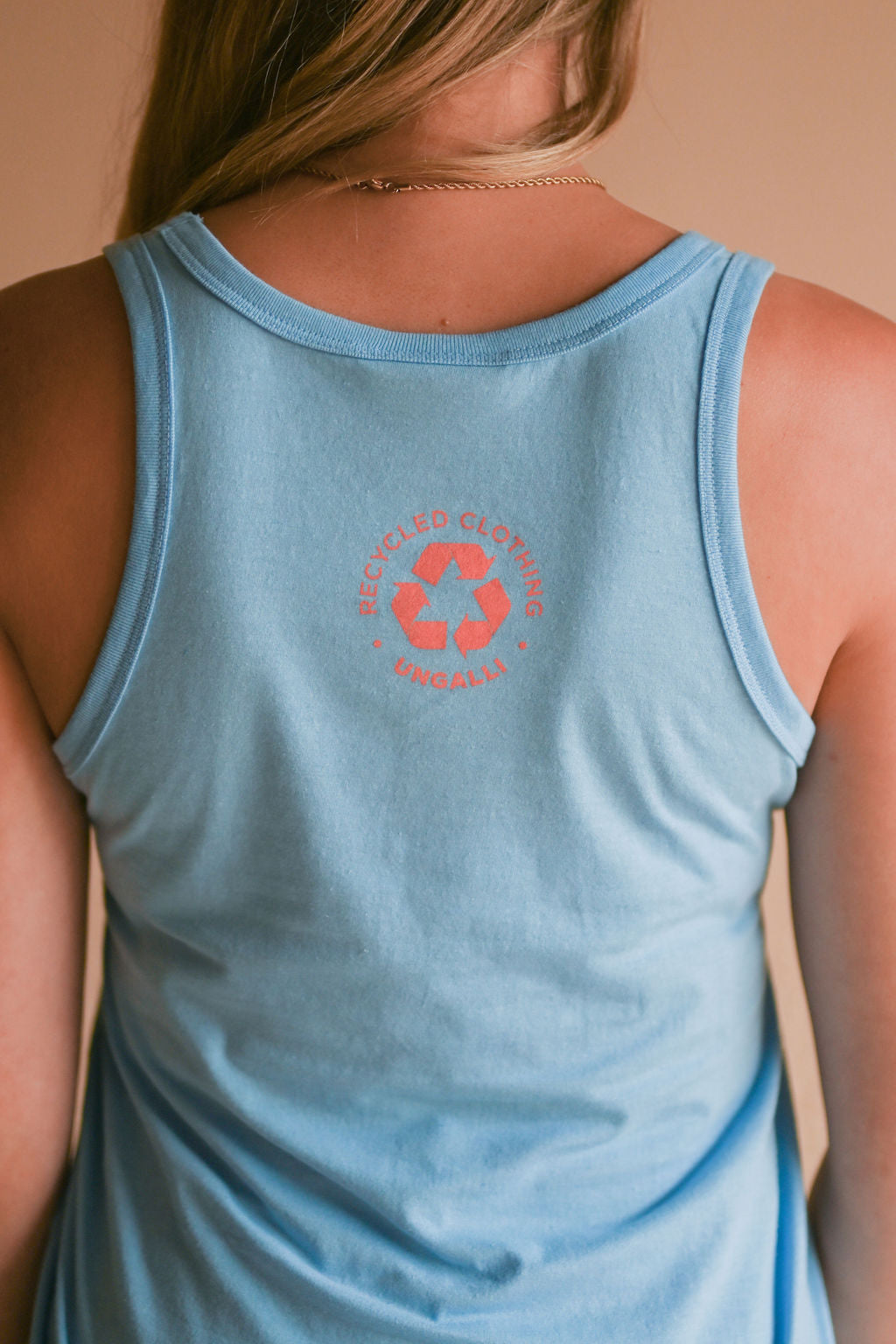 Women's organic blue tank top with pink Ungalli logo on front