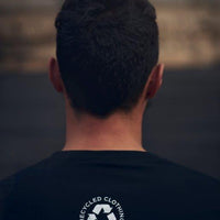 Men's (unisex) sustainable long sleeve black shirt with white Ungalli logo on front