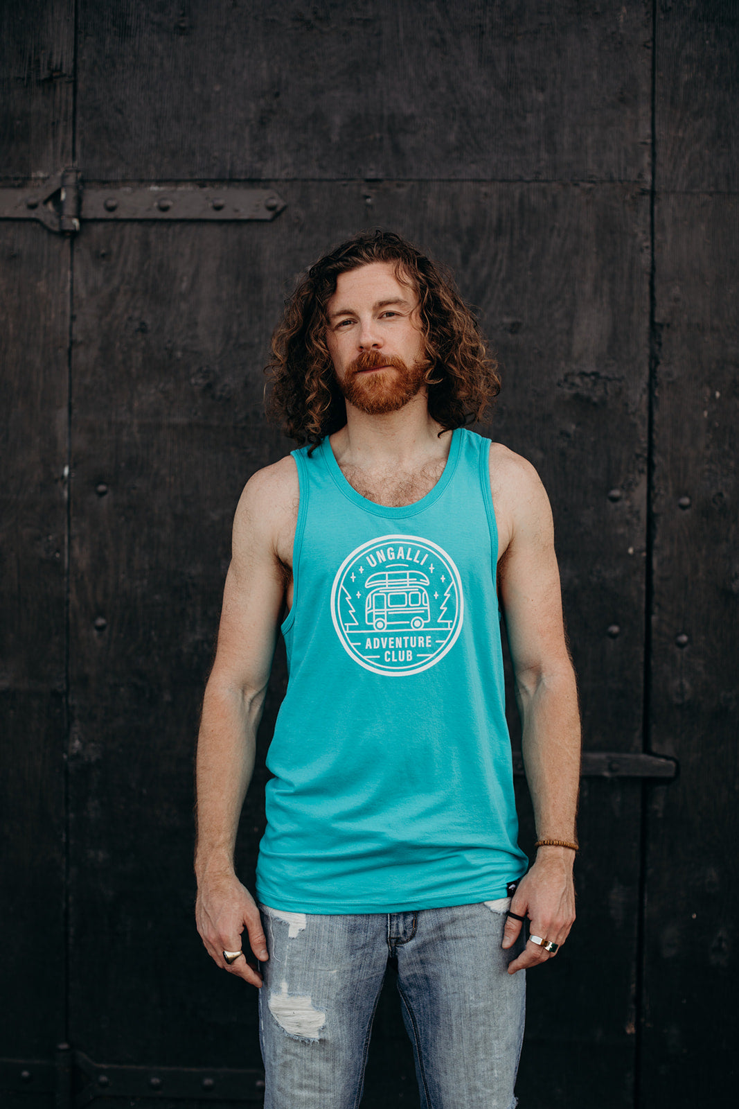 Men's organic teal tank top with white details