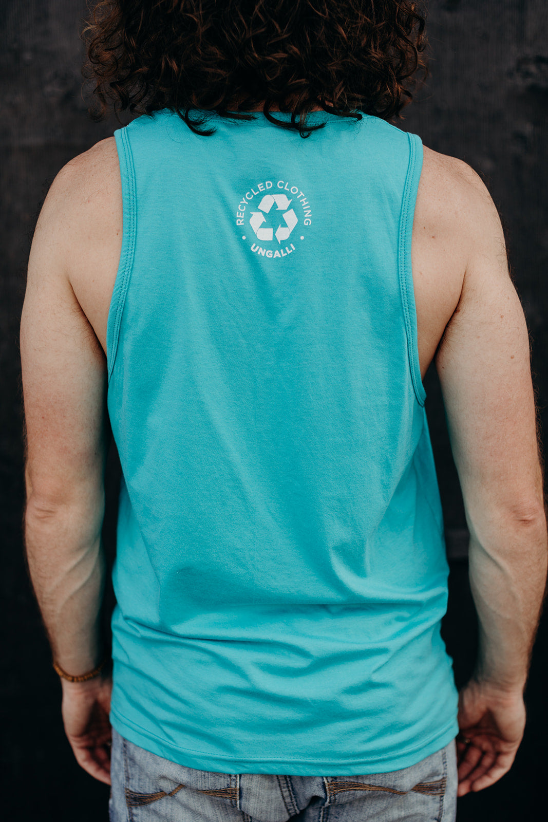 Men's organic teal tank top with white details