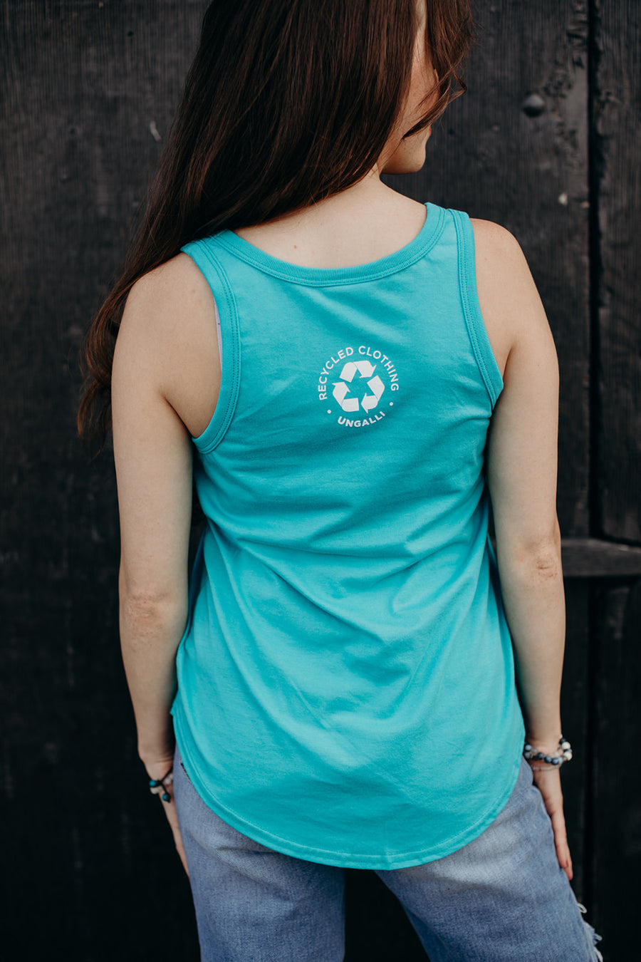 Women's organic teal tank top with white 'adventure club' logo