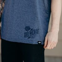 Unisex short sleeve blue ethically made t-shirt with 'still we rise' rose design