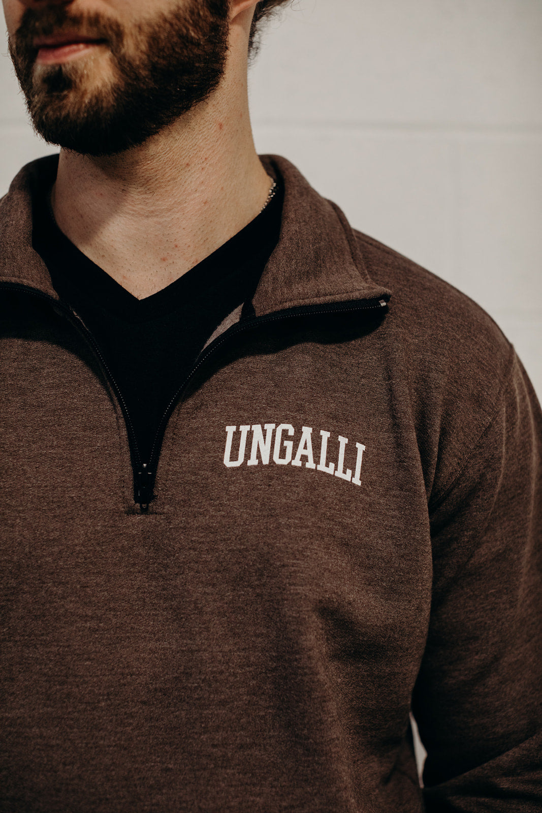 Brown unisex recycled 1/4 zip sweater with small Ungalli logo in white on front