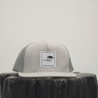 Unisex ethically made flat brim snapback hat in black or grey with white Ungalli logo on front