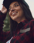 Unisex ethically made flat brim snapback hat in black or grey with white Ungalli logo on front