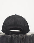 Unisex ethically made flat brim snapback hat in black or grey with white Ungalli logo on front