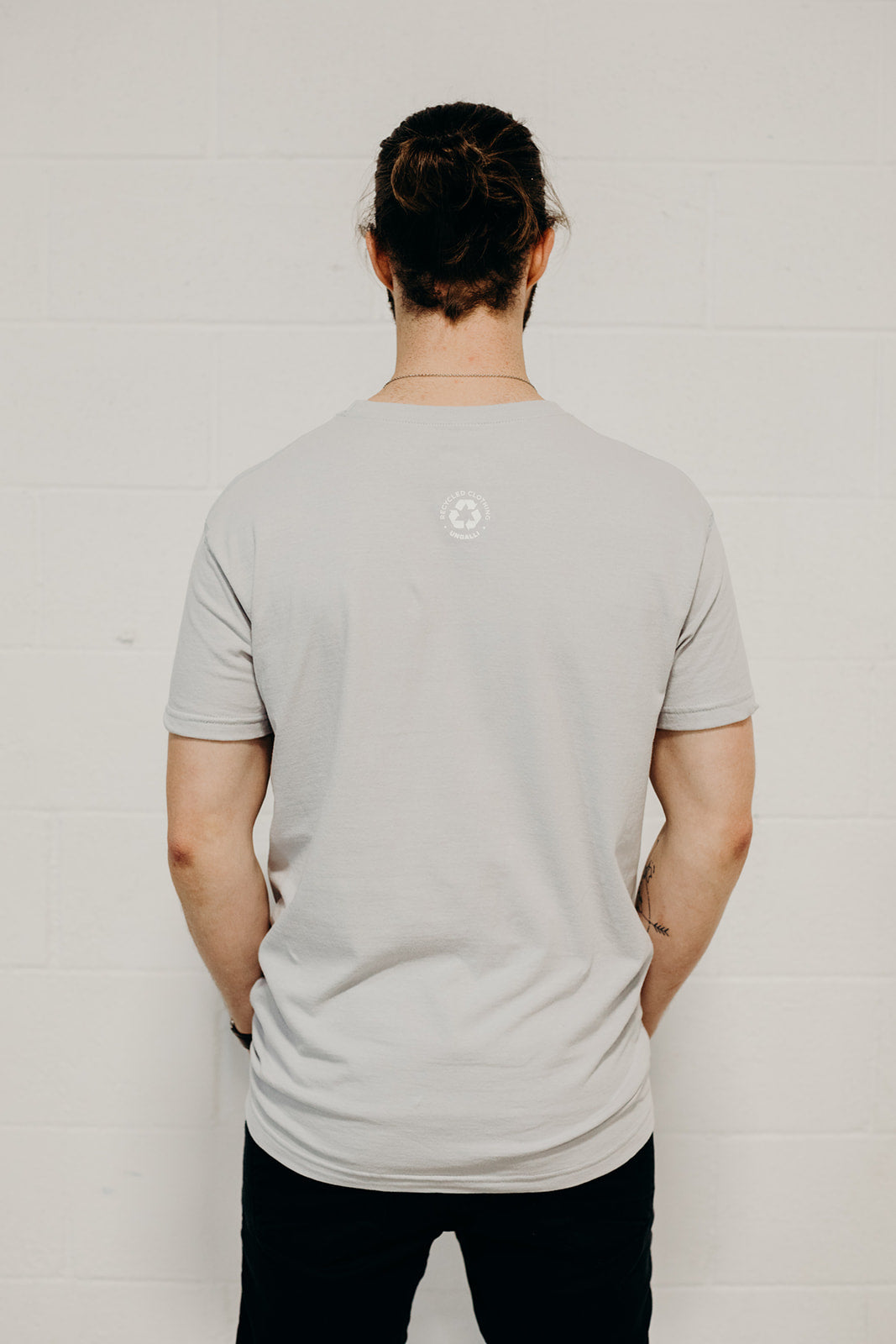 Ethically made grey short sleeved 'In Our Hands' unisex pocket t-shirt with Earth logo