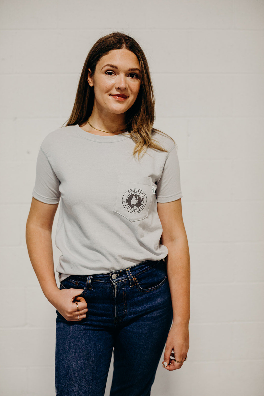 Ethically made grey short sleeved 'In Our Hands' unisex pocket t-shirt with Earth logo