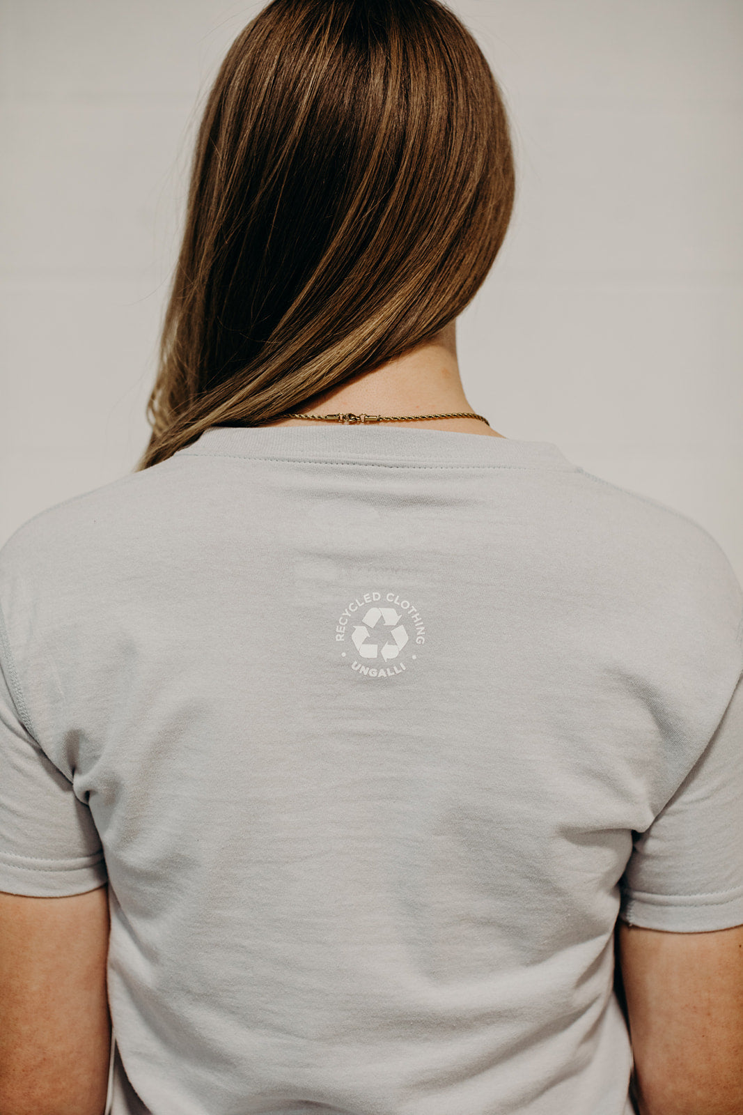 Ethically made grey short sleeved 'In Our Hands' unisex pocket t-shirt with Earth logo