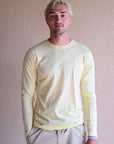 Unisex ethically made long sleeve yellow shirt with small white ungalli tree on front
