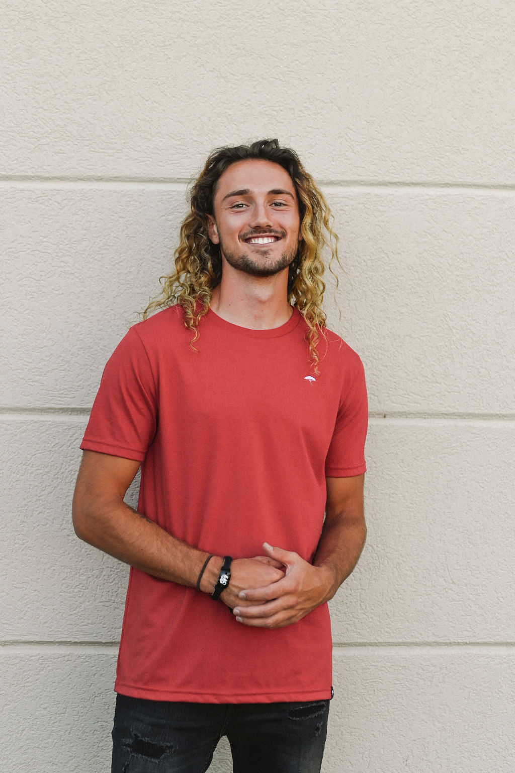 Unisex sustainably made red t-shirt with small white ungalli tree on front