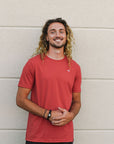 Unisex sustainably made red t-shirt with small white ungalli tree on front