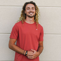 Unisex sustainably made red t-shirt with small white ungalli tree on front