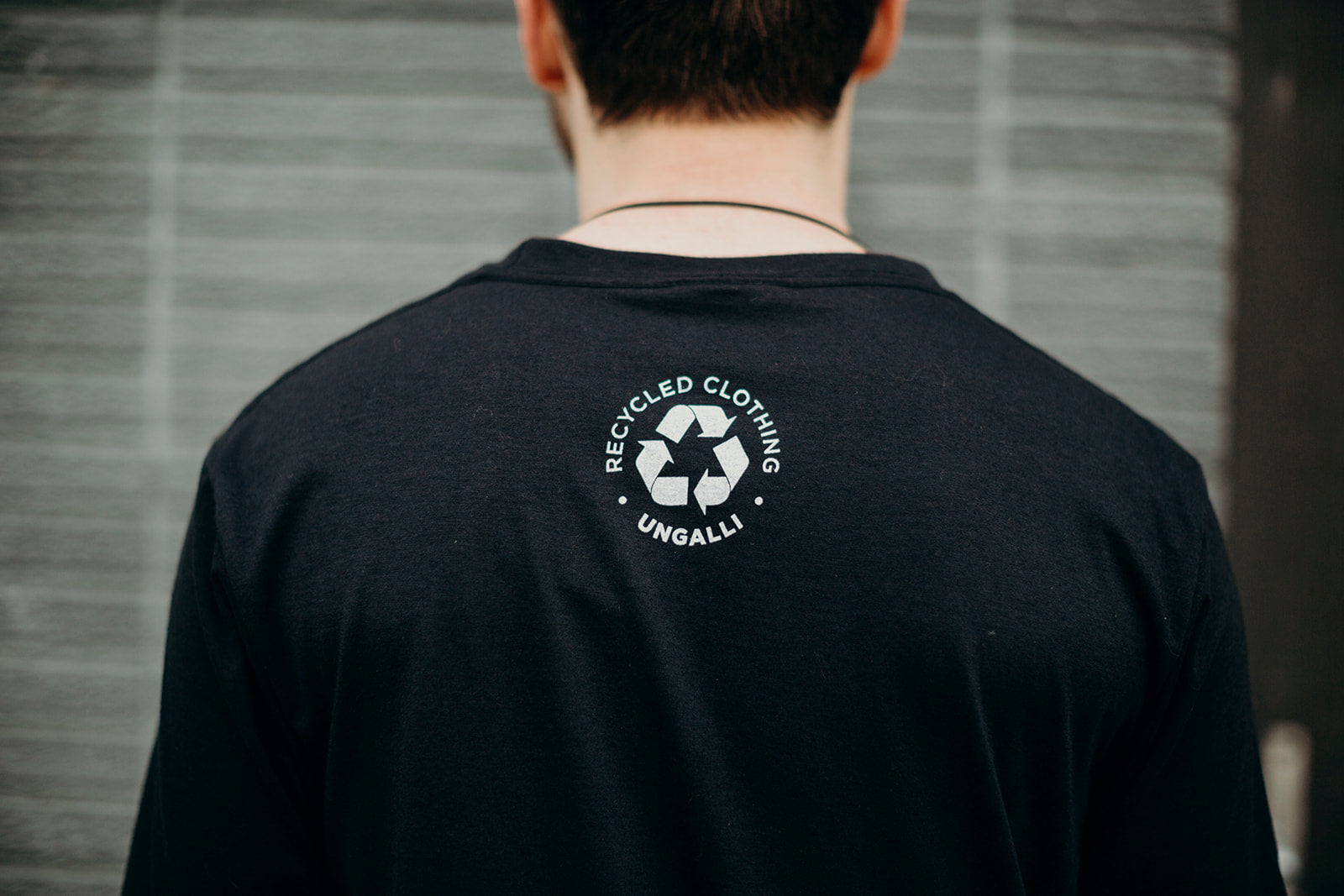 Unisex black organically made t-shirt with white tree design across front