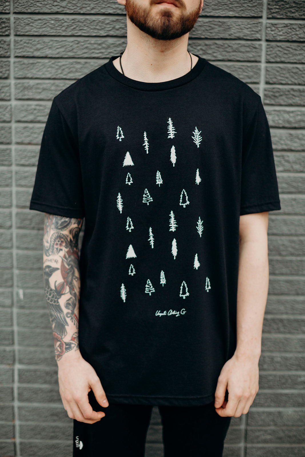 Unisex black organically made t-shirt with white tree design across front
