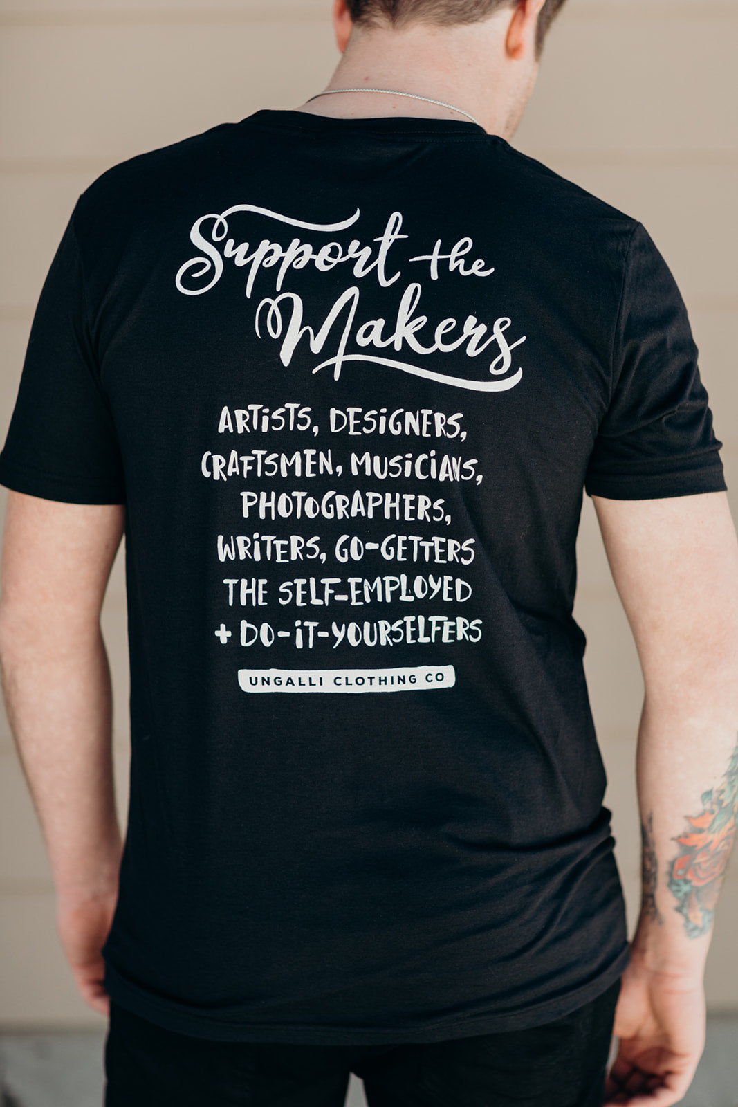 Organic short sleeve black unisex 'support the makers' t-shirt with white text