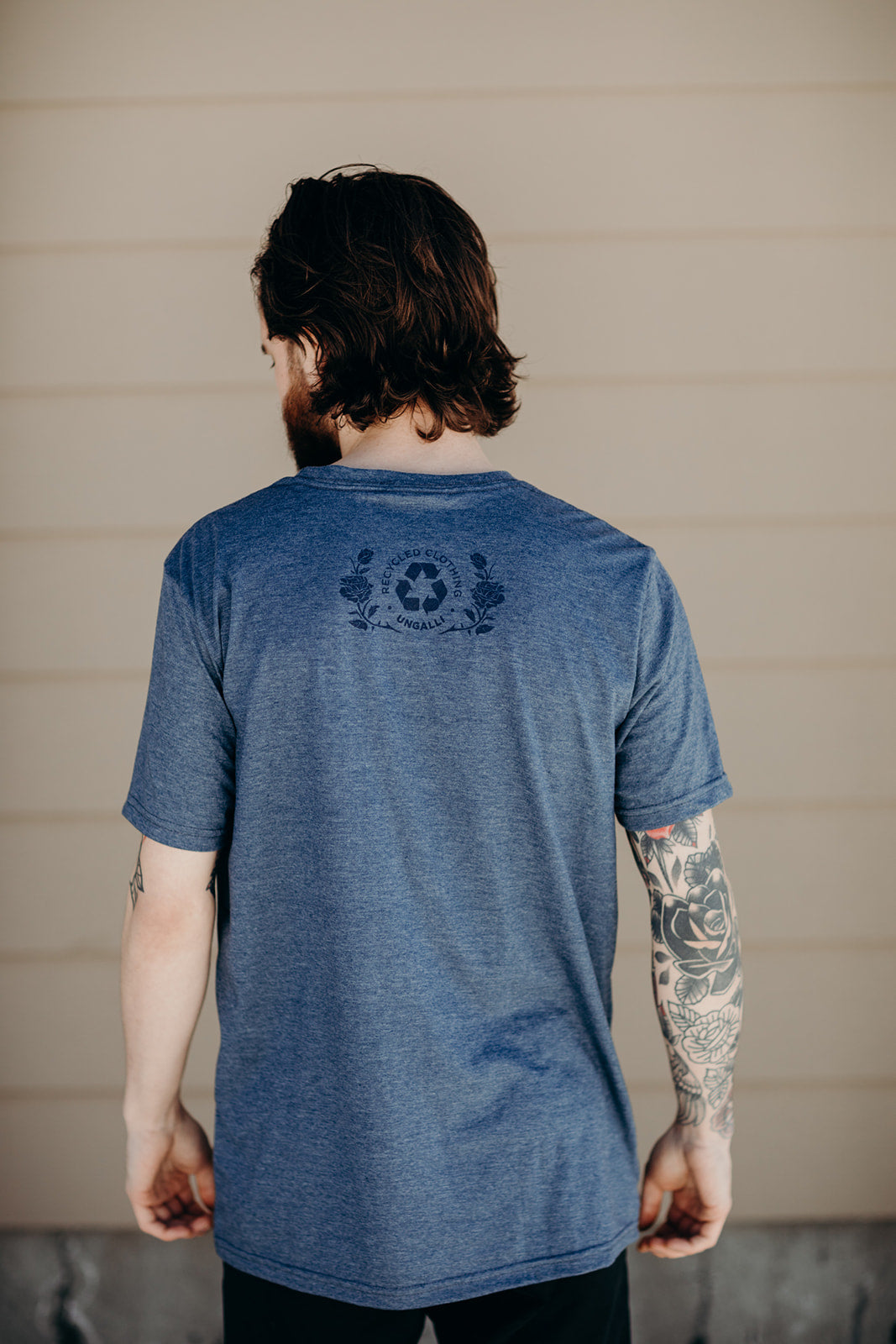 Unisex short sleeve blue ethically made t-shirt with 'still we rise' rose design