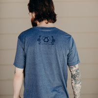 Unisex short sleeve blue ethically made t-shirt with 'still we rise' rose design