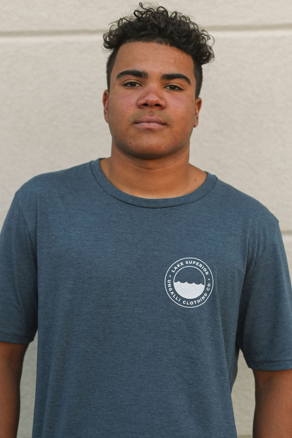 Organically made unisex short sleeve t-shirt in blue with white Lake Superior logo on front