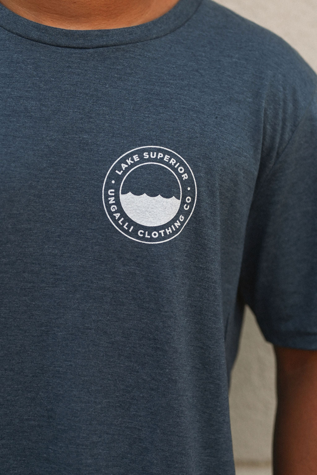 Organically made unisex short sleeve t-shirt in blue with white Lake Superior logo on front