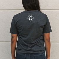 Recycled grey short sleeve unisex t-shirt with text on front that reads: "human change climate change"