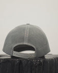 Unisex organic snap back hat in grey or black with multicoloured Ungalli/sleeping giant design on front