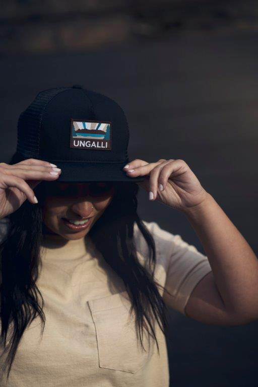 Unisex organic snap back hat in grey or black with multicoloured Ungalli/sleeping giant design on front