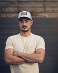 Unisex organic snap back hat in grey or black with multicoloured Ungalli/sleeping giant design on front