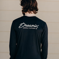 Unisex recycled long sleeve black shirt with Dreamin' airplane design on front and text on back