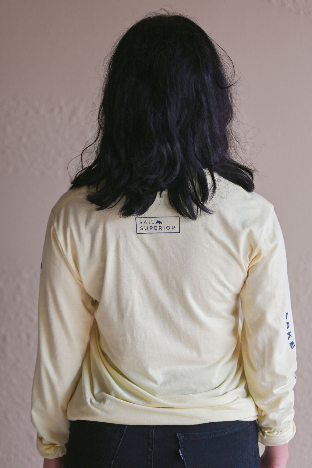 Unisex long sleeve organic shirt with blue sail boat logo and text