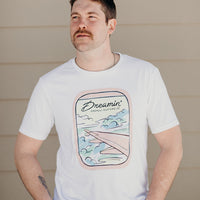 Organic white unisex t-shirt with multi-coloured dreamin' plane logo on front