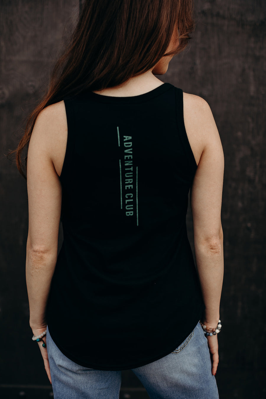 women's black recycled tank top with multi coloured 'adventure club' logo