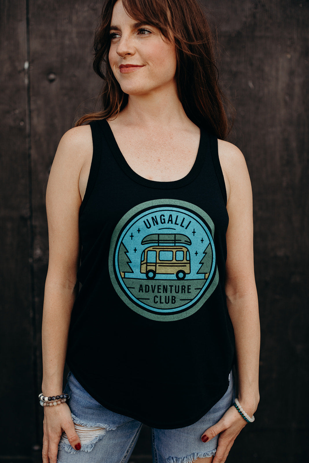 women's black recycled tank top with multi coloured 'adventure club' logo