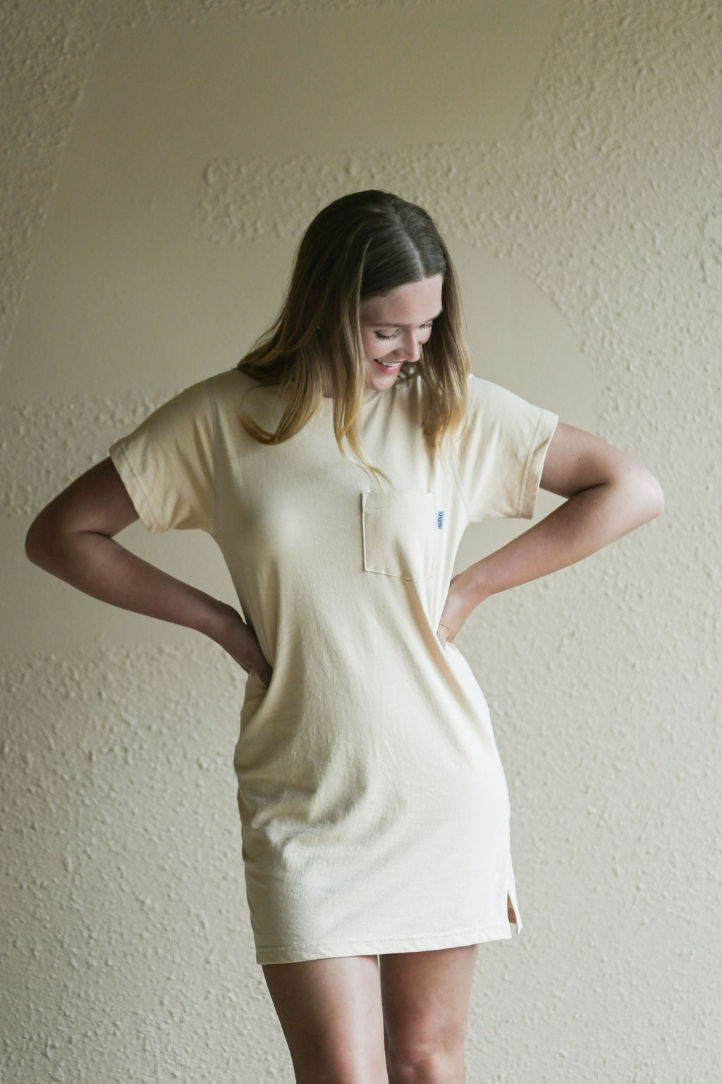 Women's beige t-shirt dress with front pocket sustainably made in Canada