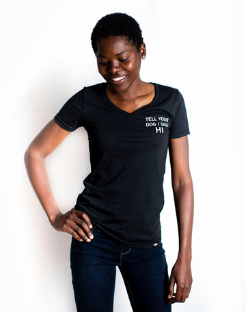 Women's organic short sleeve black t-shirt with text that reads 'Tell your dog I said HI' on front