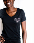 Women's organic short sleeve black t-shirt with text that reads 'Tell your dog I said HI' on front