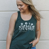 Women's ethically made green tank top with fiddlehead design on front