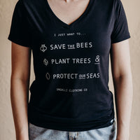 Women's short sleeve black ethically made t-shirt with text that reads: "I just want to.. save the bees, plant trees & protect our seas"