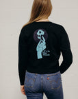 Women's sustainably made black cropped hoodie with brand logo