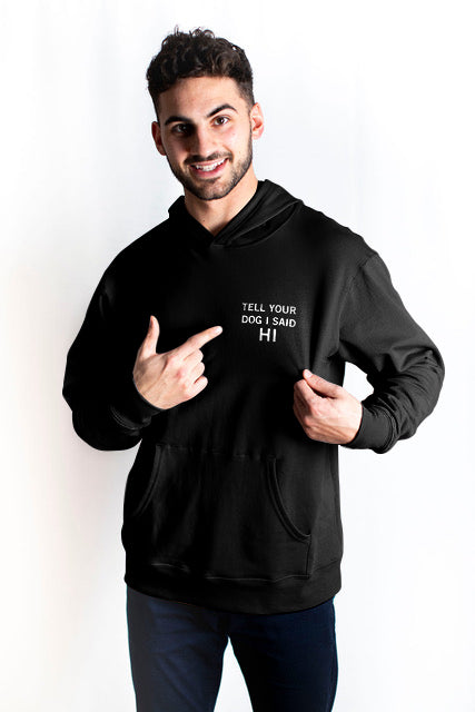 Ethically made unisex black pull over hoodie with white text reading: "Tell your dog I said HI"
