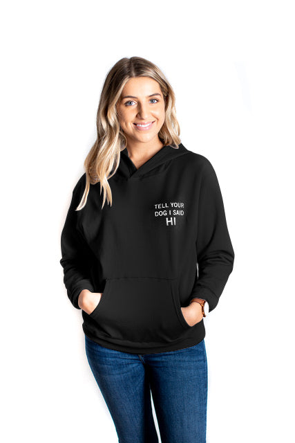 Ethically made unisex black pull over hoodie with white text reading: "Tell your dog I said HI"