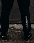 Black ethically made unisex joggers with white detailing