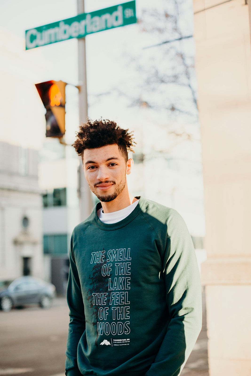 Organically made green unisex  crew neck pull over sweater with white text